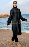 Houria gesluierde vrouw burkini